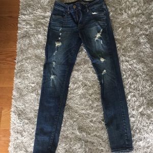Dark blue skinny jeans with rips